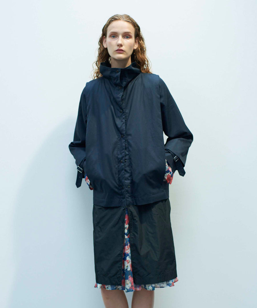 Coat with tucks
